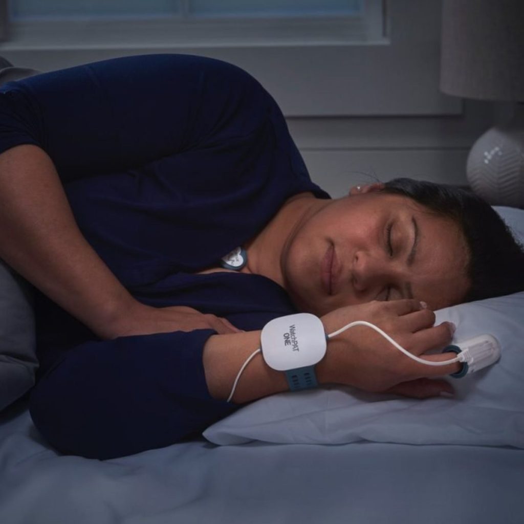 Women in bed wearing the WatchPat One Home Sleep Test | SleepTest.co.uk